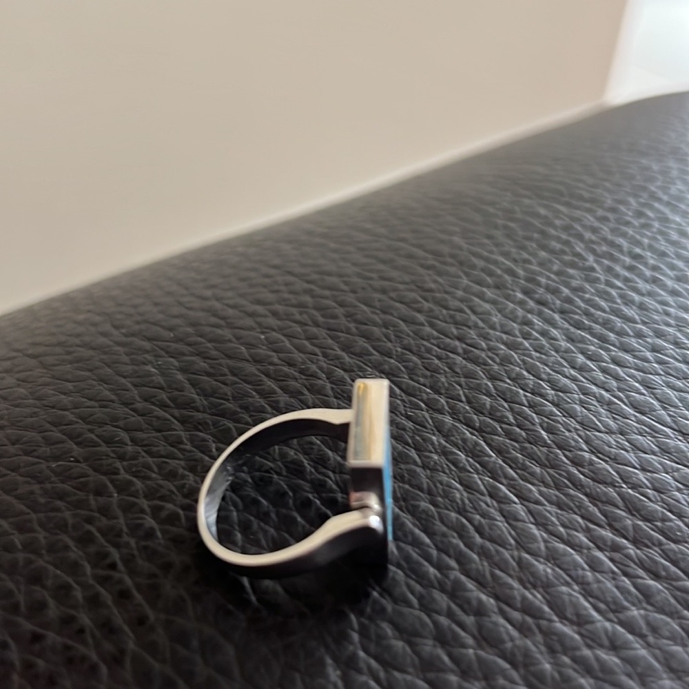 A 18 k gold necklace with reversible blue and black Gucci logo